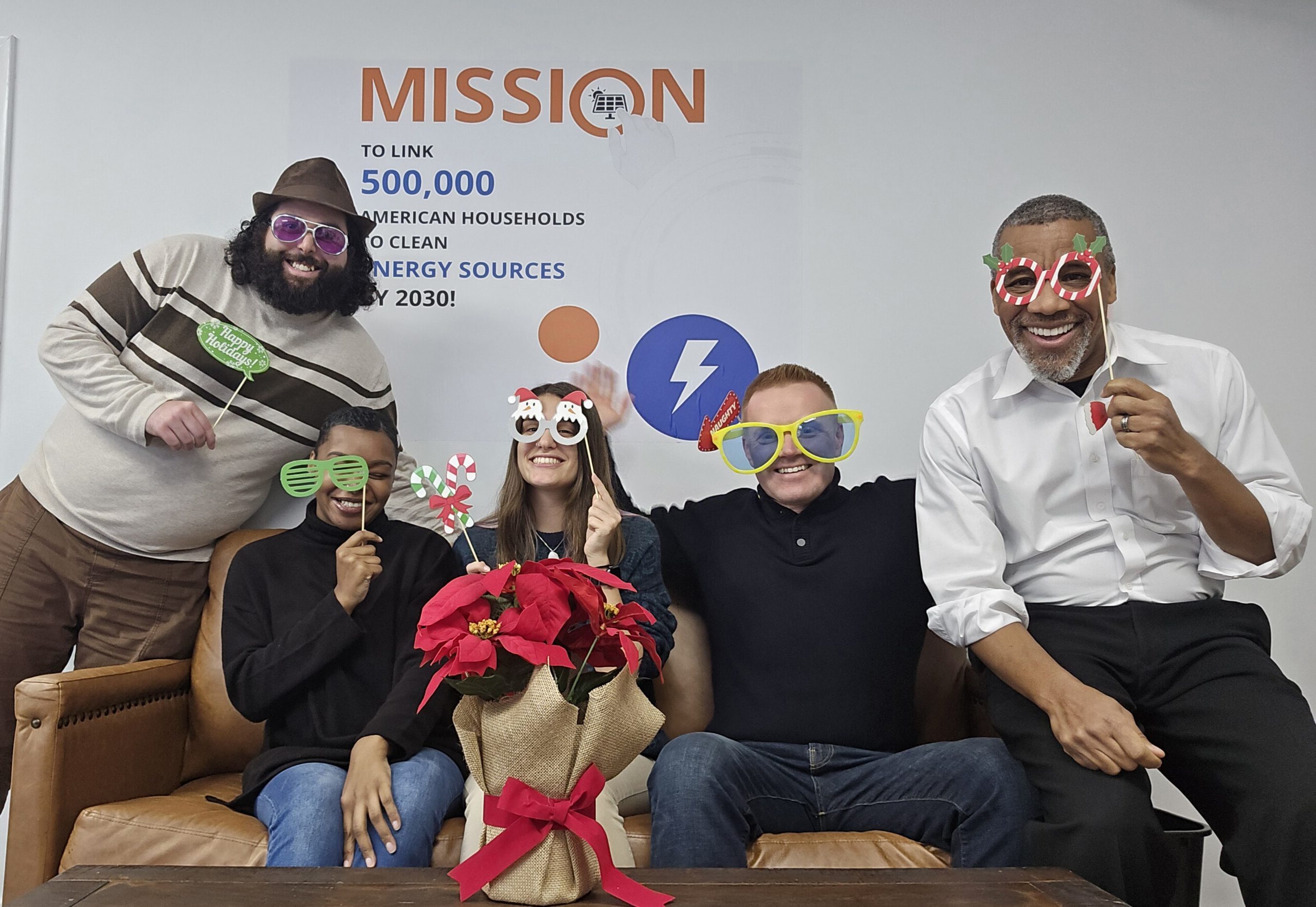 Pic1Holiday Finray Solar employees in front of our Mission wall